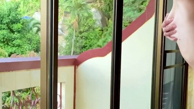 Bent the babe over on the balcony and fucked her while passers-by watched